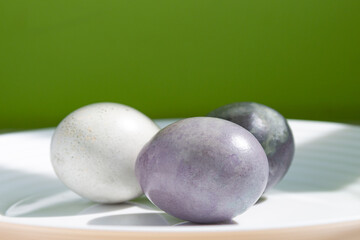 Beautiful colorful Easter eggs on a green background