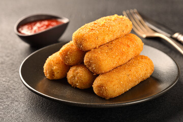 Homemade fried POTATO CROQUETTES and ketchup