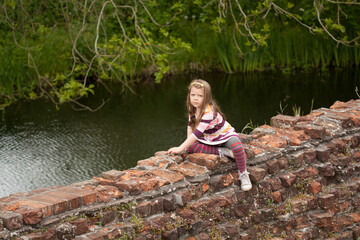 girl sitting on in the ruin