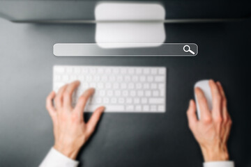 Searching internet. Online website search engine selective focus. Blured hands using computer for searching browsing internet data information networking concept.