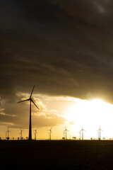 Obraz premium wind turbines at sunset 2