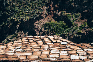 salt mines in the region of cusco peru - obrazy, fototapety, plakaty