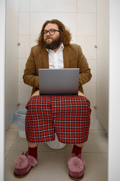 Found business man with laptop in restroom