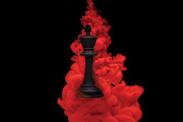  chess king floating in red ink 