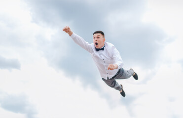 A man, a businessman is flying in the sky, hurrying to work. Photography, concept.