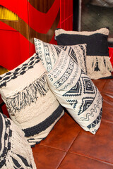 comfortable pillows on the sofa. Close-up. Pillows with ornaments.