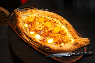 Khachapuri is a dish of Georgian cuisine, a Georgian national flour product, a pie stuffed with cheese and eggs. Caucasian cuisine.