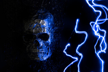 human skull with lightning on a dark background