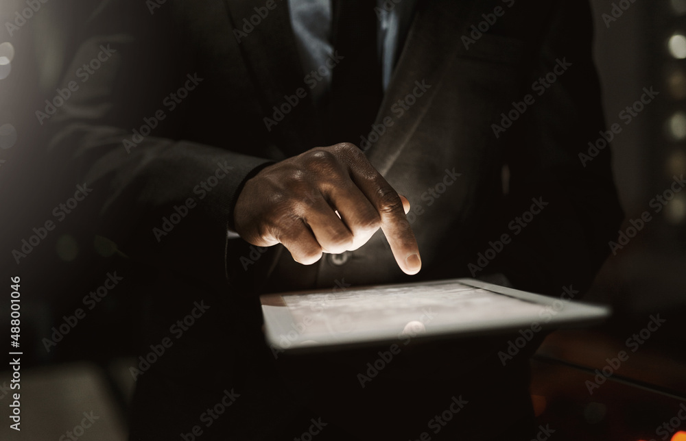 Poster prepared to do business. cropped shot of an unrecognizable businessperson browsing on a digital tabl