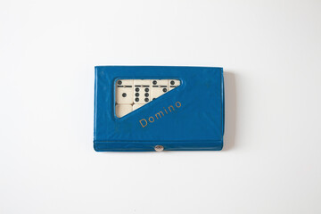 Vintage domino on white background. Close up, flat lay, top view, copy space.