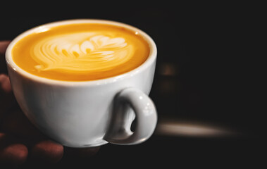 Barista hand making cappuccino Coffee with espresso and milk in cafe