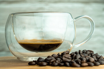 A cup of coffee with beans