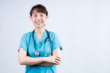 Covid-19, social distancing and coronavirus pandemic concept. Close-up portrait of confident smiling asian female doctor