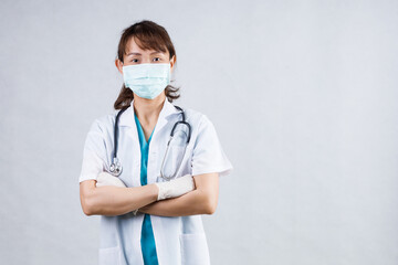 Covid19, coronavirus, healthcare and doctors concept. Portrait of professional confident young asian doctor in medical mask and white coat, stethoscope over neck, ready help patient, fight disease