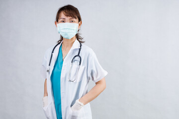 Covid19, coronavirus, healthcare and doctors concept. Portrait of professional confident young asian doctor in medical mask and white coat, stethoscope over neck, ready help patient, fight disease