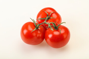 Red bright ripe tomato branch