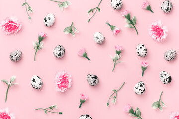 Easter composition with spring herbs, flowers and eggs on pastel pink background close up. Minimal easter concept. Flat lay with copy space.