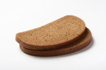 Rye whole grain bread on a white background. Proper nutrition.