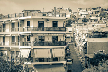Fototapeta premium Typical street road buildings cars in Greeces capital Athens Greece.