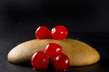 Macro Image of Molasses Cookie with Red Cherries
