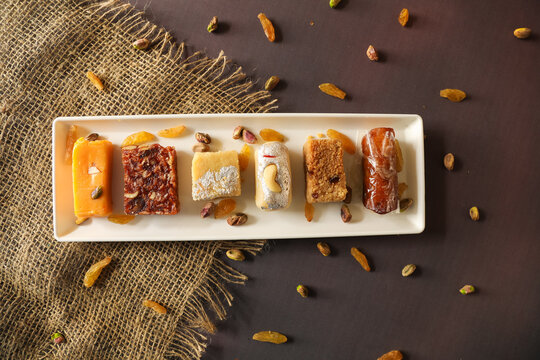 indian sweets in a plate on table,closeup,corner,center with selective focus and blur