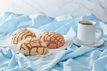 Concha, Mexican sweet bread with a cup of coffee.