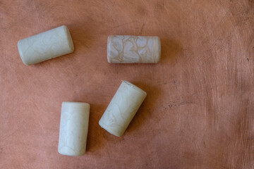 Synthetic wine corks on the copper metal background. Copy space. 