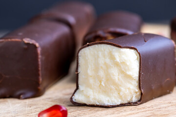 dessert of creamy filling and chocolate on a board