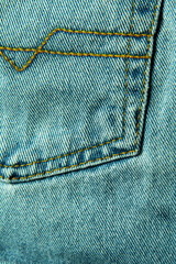 Pocket of blue jeans. Abstract background. Draped background of classic jeans fabric, texture....