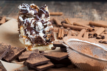 a multi-layered cake made of chocolate and cream cakes