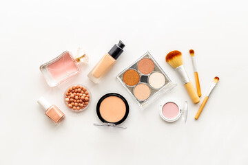 Decorative makeup cosmetic on color background, top view