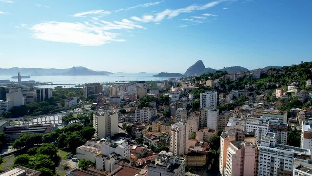 Panning wide view of downtown city of Rio de Janeiro Brazil. Tourism landmark. Offices buildings exterior and harbor zone near Guanabara bay.  