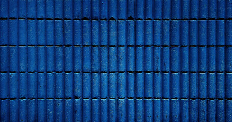 blue corrugated brick wall background in curve pattern, retro Brick wall background for exterior. abstract old vintage brick wall backdrop, old texture of blue stone blocks