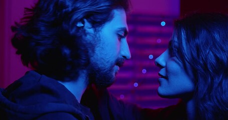 passion, attraction -couple looks into each other's eyes and kisses passionately