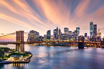Brooklyn Bridge at sunset viewed from Brooklyn Bridge Park, with the Lower Manhattan skyline in the...