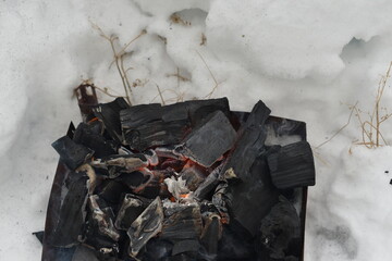 the coals are burning in the grill