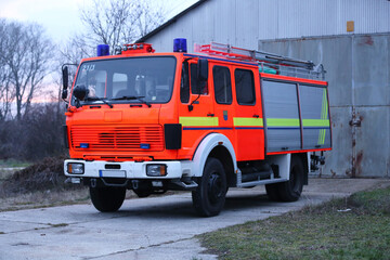 Red fire engine car parked without firemen