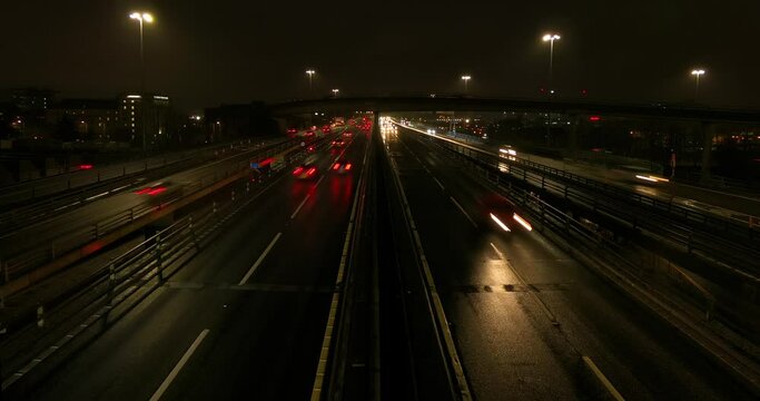 Night timelapse of traffic passing through Glasgow on the M8 motorway on a weekday evening.