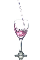 Filling red wine in glasses isolated on white background
