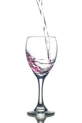 Filling red wine in glasses isolated on white background
