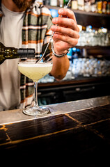 man hand bartender making cocktail on the bar counter