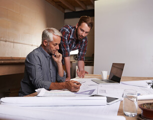 Turning his vision into reality. An architect drawing up plans.