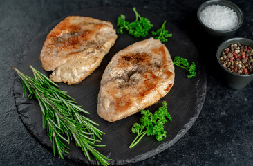grilled chicken chops on stone background