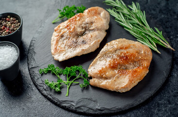 grilled chicken chops on stone background