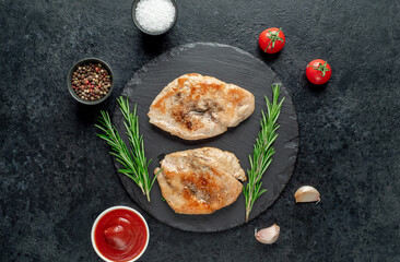 grilled chicken chops on stone background