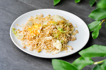 stir fried noodles with pork and vegetable in the pan