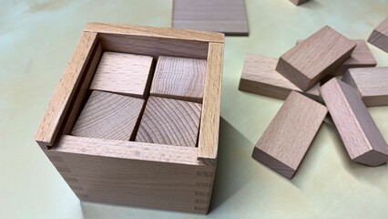 Children's educational game made of natural wood for teaching geometric shapes, counting and...