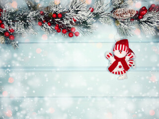 Naklejka na ściany i meble christmas snowman toy with fir branches decor and snow