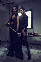 Young women wear black fashion wear posing in studio