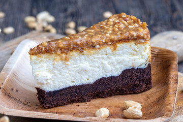 creamy chocolate cake with caramel and roasted peanuts